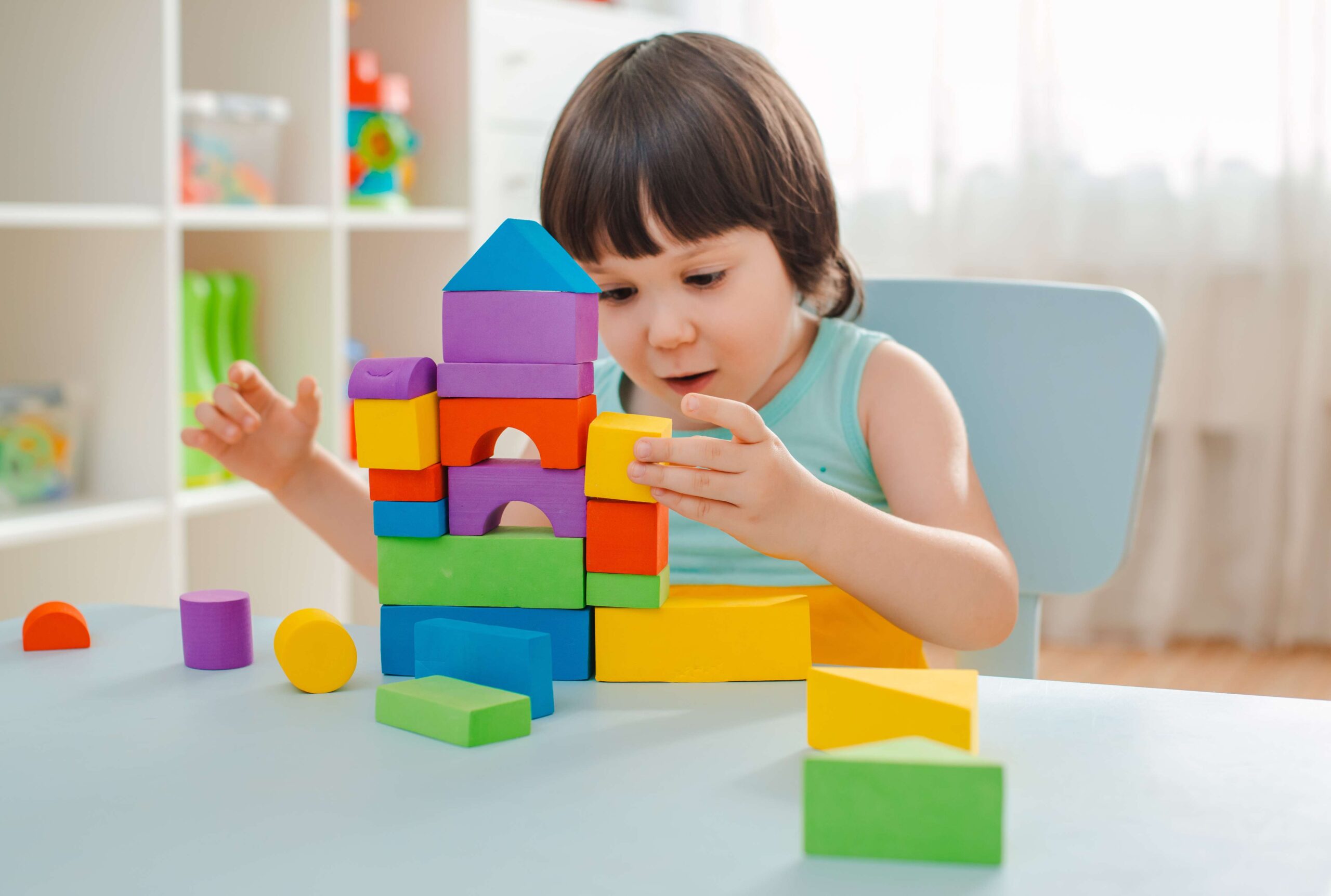 little-girl-collects-wooden-unpainted-pyramid-safe-natural-wooden-children-s-toys (1)